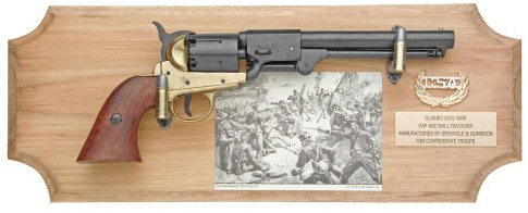 Framed display of Confederate-made  revolver on light wood.