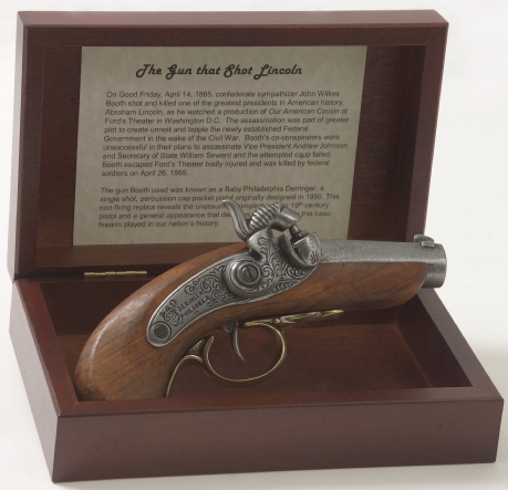 Boxed display of Lincoln assassination replica revolver.